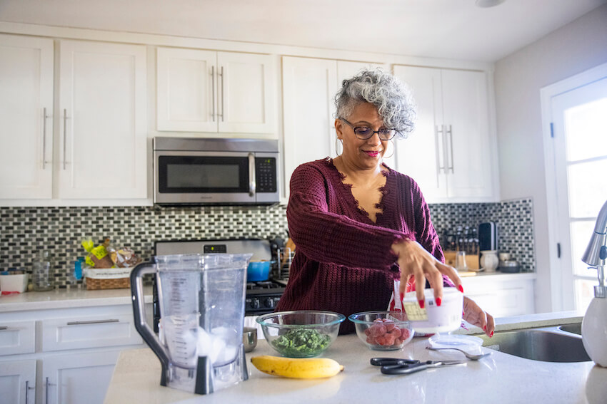 Woman making a healthy smoothie