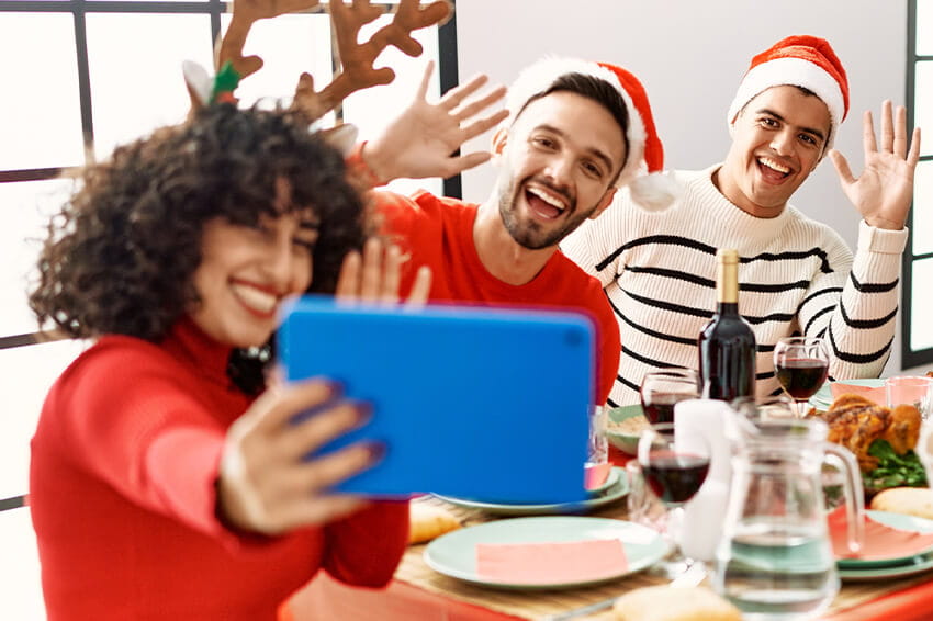 LGBTQ family holiday gathering with iPad