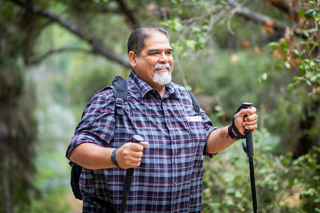 Older man out hiking in nature