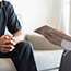 doctor showing man lung screening results