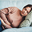 woman holding abdomen in pain