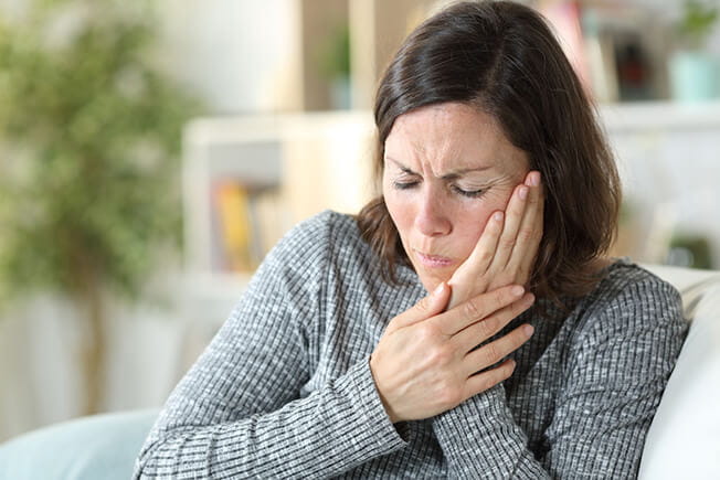 Woman with jaw pain