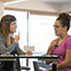 Speech therapist teaching woman with vocal exercise