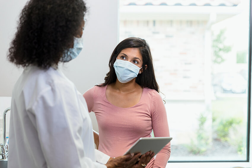 Female patient meeting with female doctor