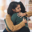 Two woman embracing each other