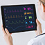 Doctor watching vital signs with tablet