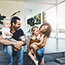 Family sitting on steps of porch