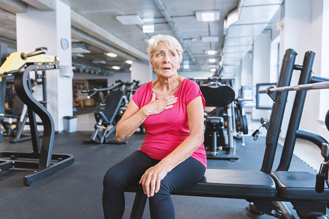 Senior woman feeling tired after workout