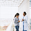 Doctor explains patient's test results to woman.