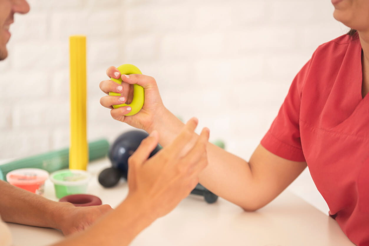 Physiotherapist is examining patient