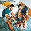 Two men playing indoors with their daughter.