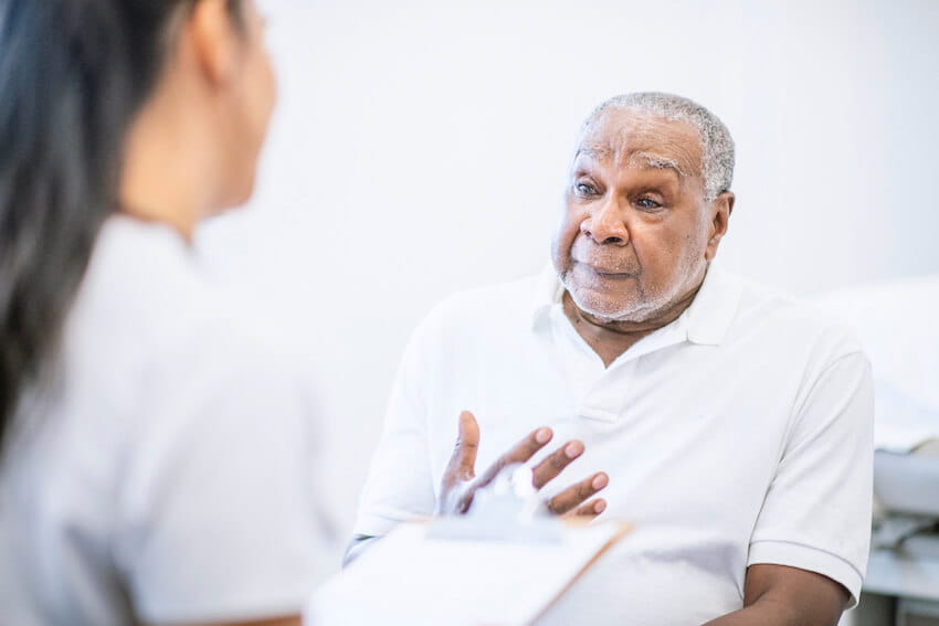 Man discussing health with doctor