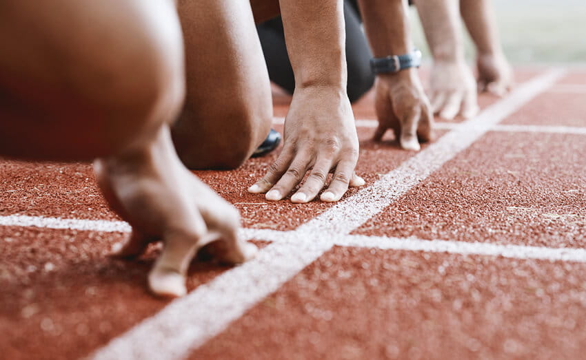 Group of athletes ready to start a race.