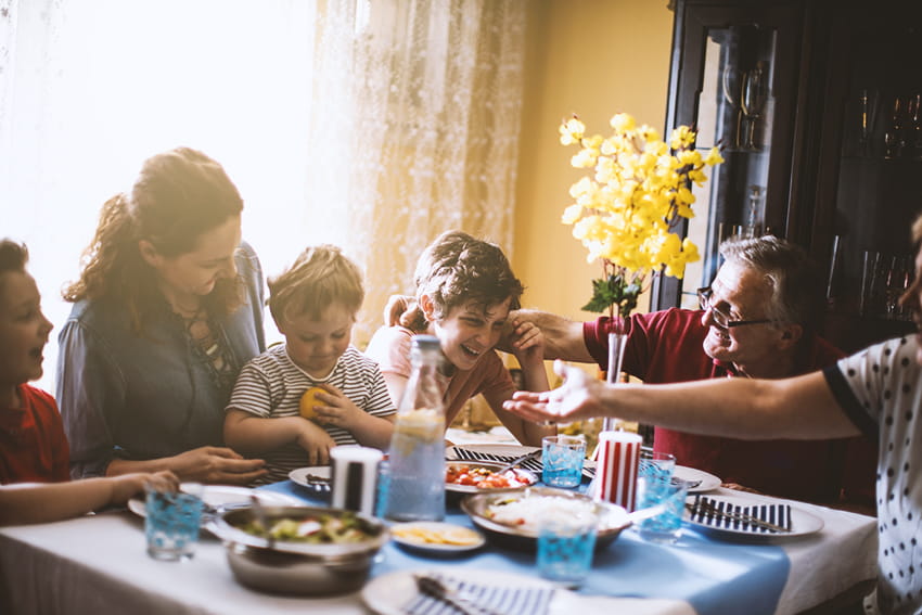 Multi-generational family having dinner.