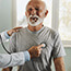 A doctor listening to a patient's heart.