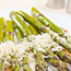 Plated asparagus with parmesan cheese.