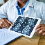 Doctor evaluating brain scan images.