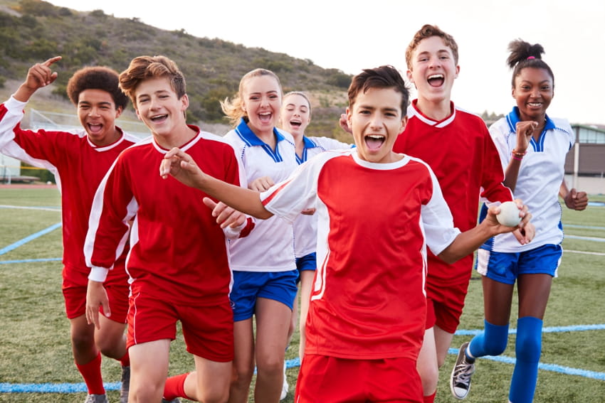 High school soccer team celebrating.