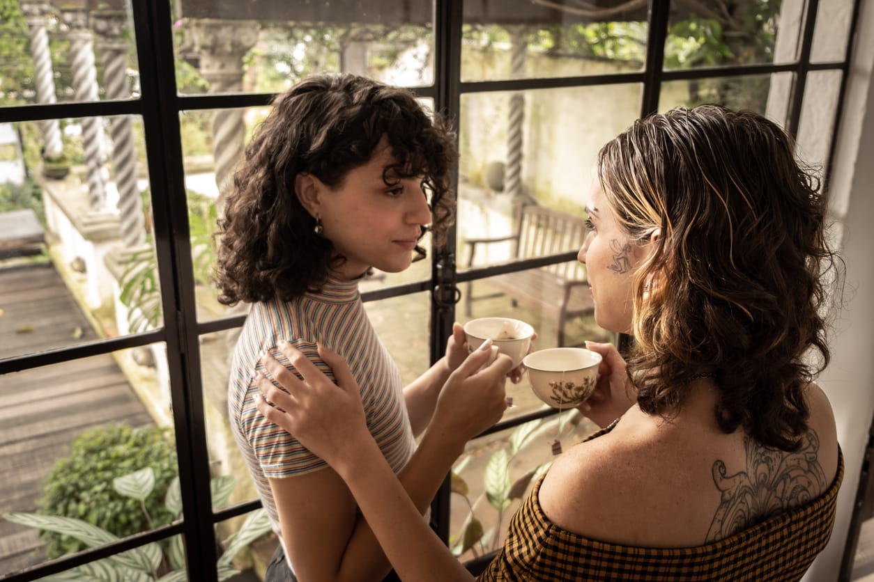 ransgender woman consoling friend or partner at home.