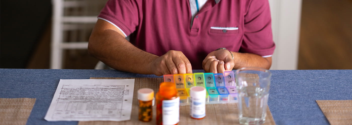 Man at doctor's office having heart listened to.
