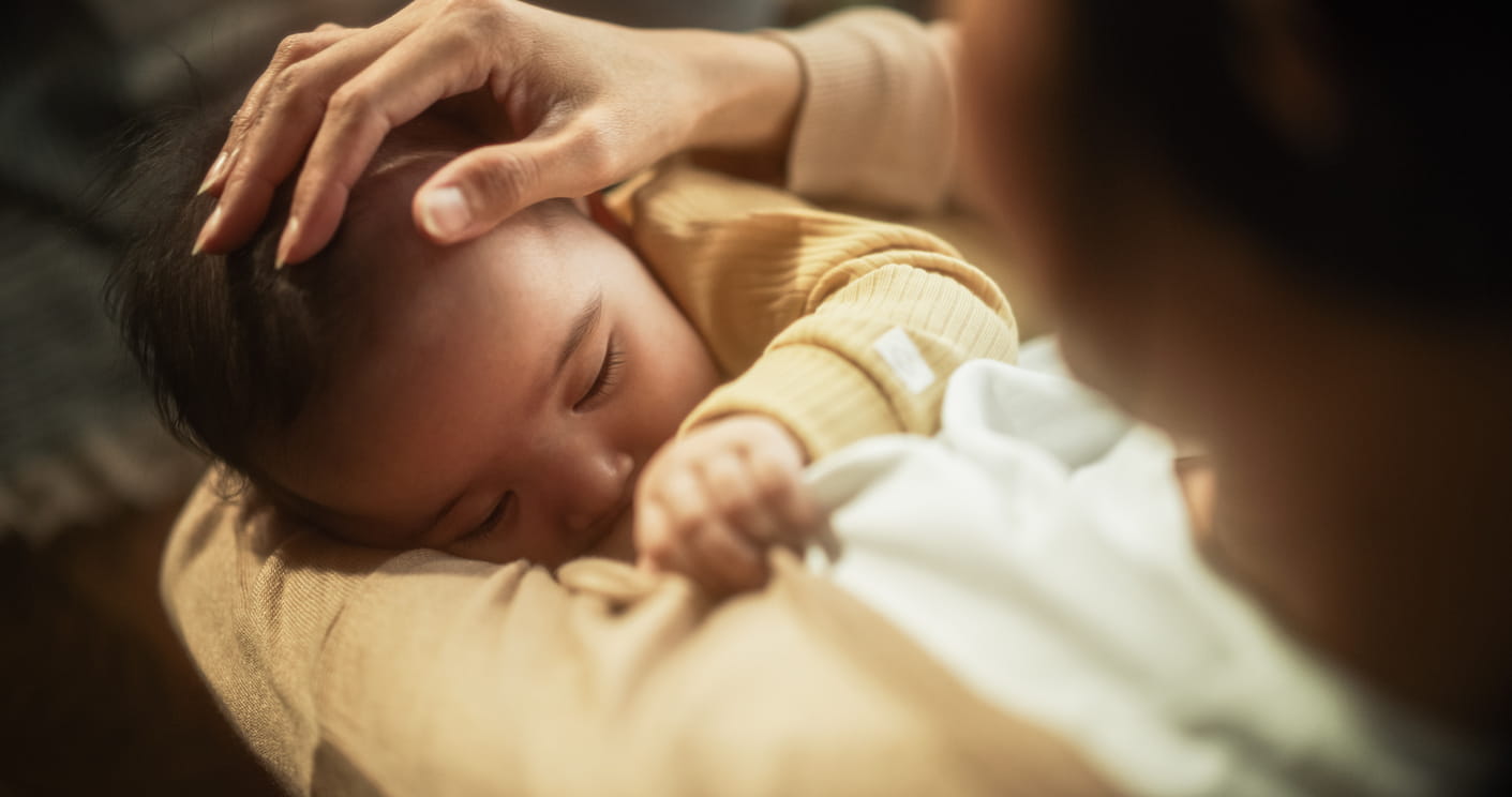 Baby Feeding from the Breast of Her Mother