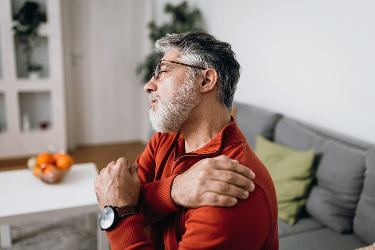 Mature man having problems with his shoulder