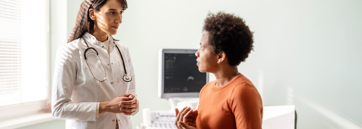 A female doctor talks with her patient