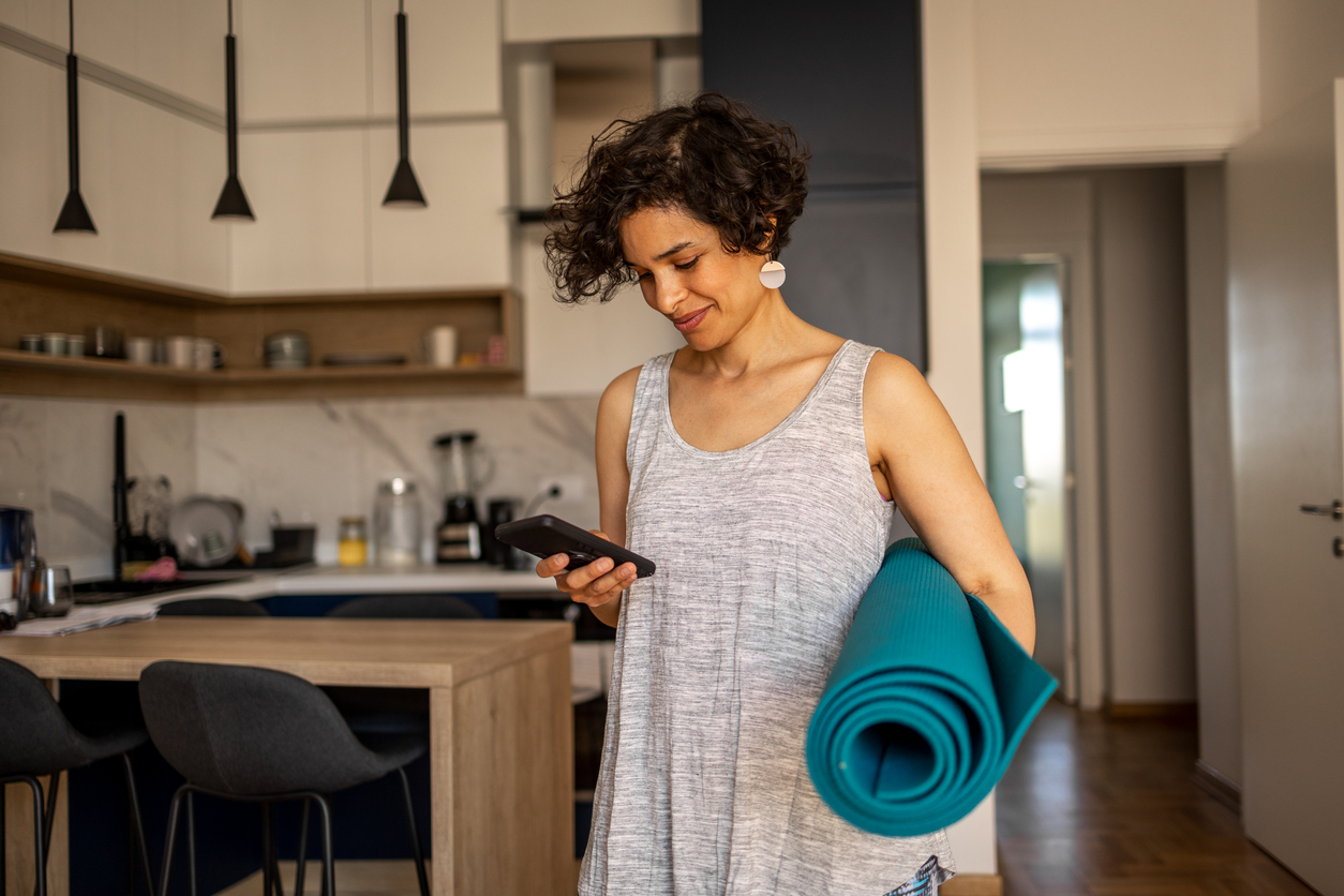 Woman getting ready for her yoga practice.