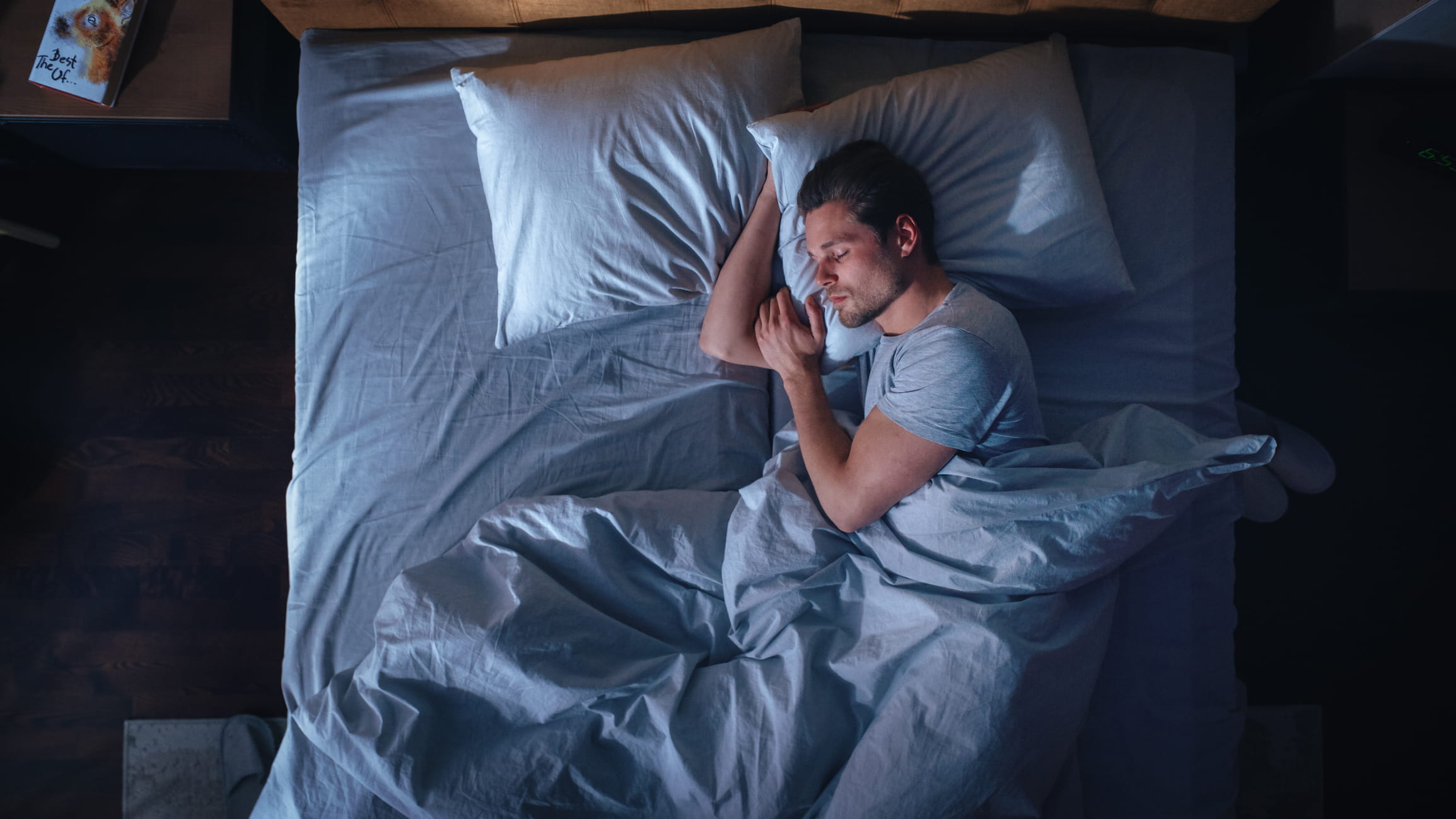 man sleeping in bed