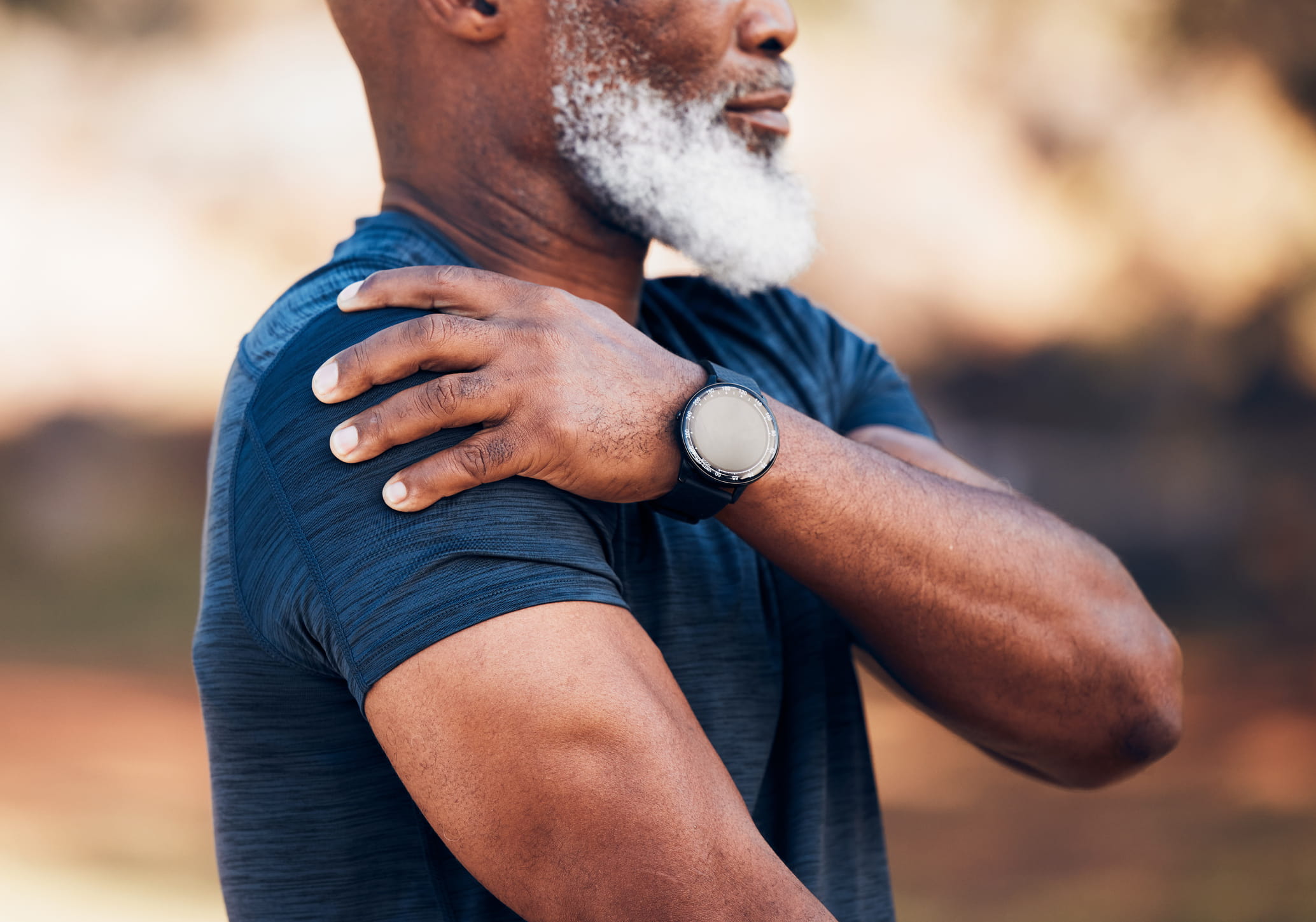 Man holding his shoulder.