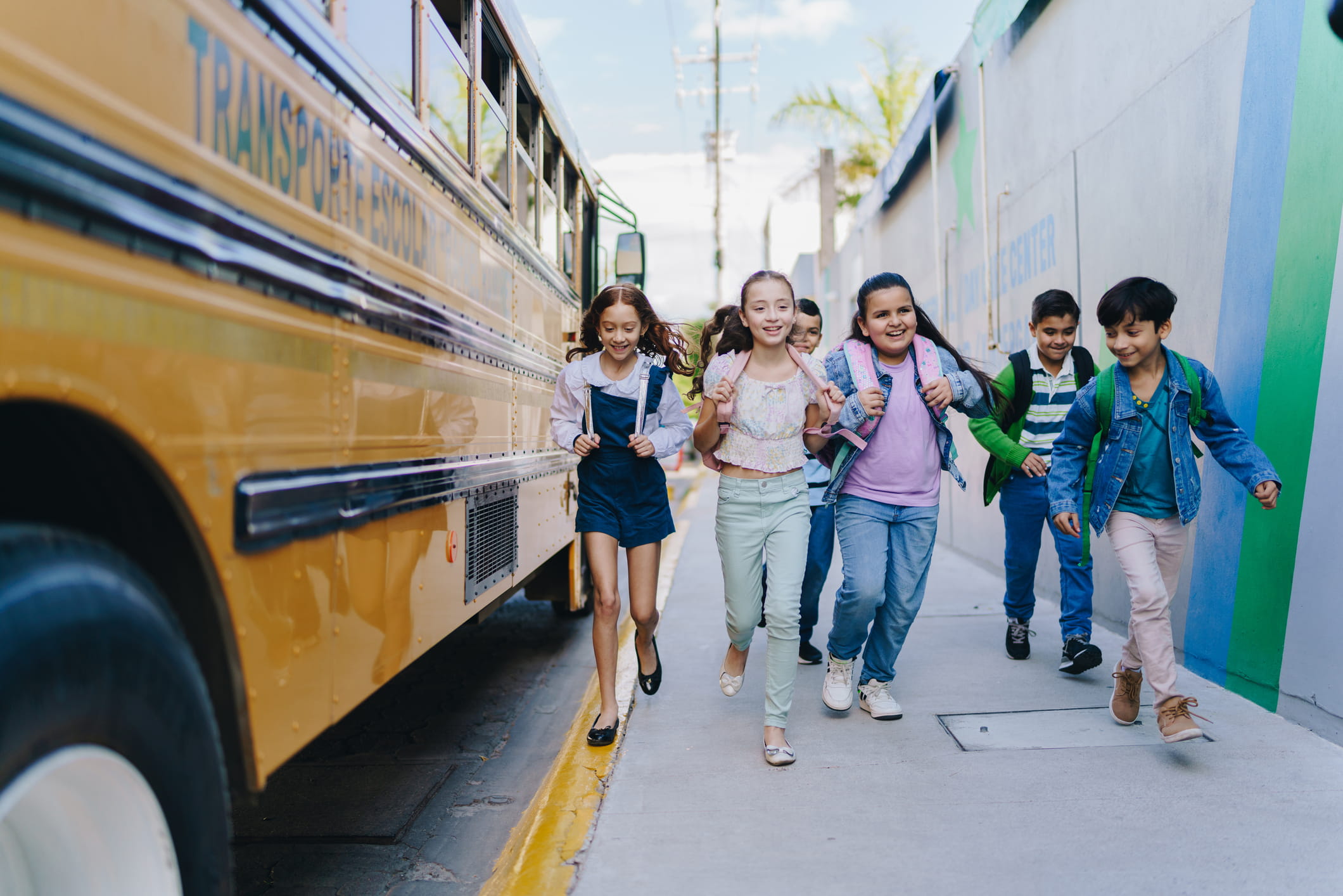 Kids getting off the bus for school