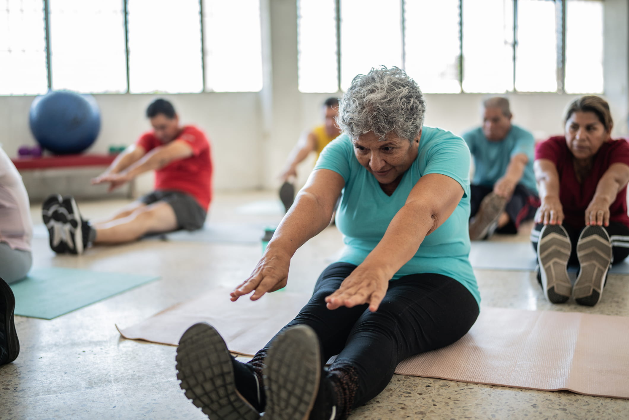 Older woman doing a core exercise