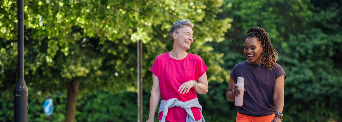 Two women walking in a park