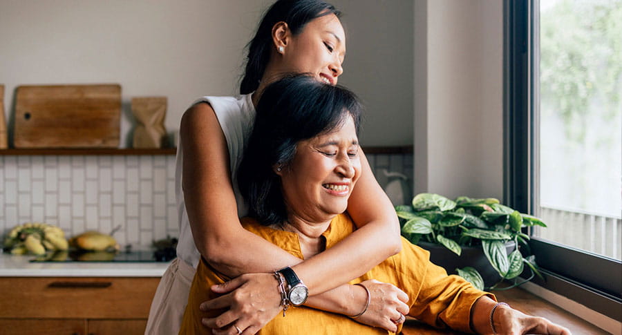Mother with daughter in kitchen