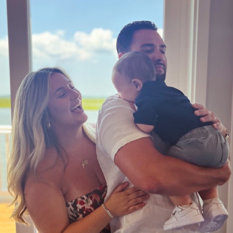 Allanna Dippolito and her partner holding their baby