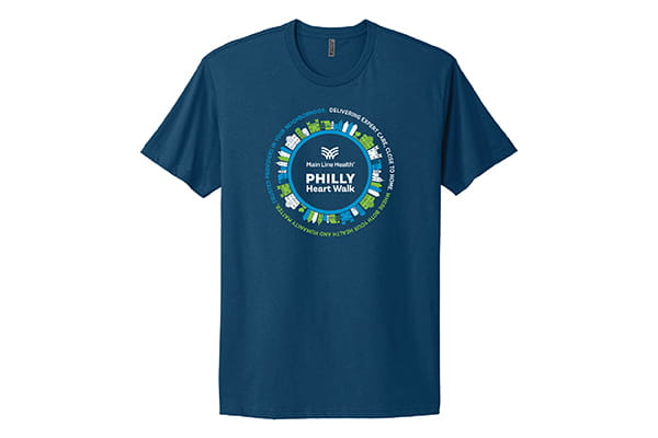 Dark blue T-shirt with illustrations of homes forming a circle around "Philly Heart Walk." Also circling the illustration is "Trusted Providers in Your Neighborhood. Delivering Expert Care, Close to Home. Where Both Your Health and Humanity Matter."