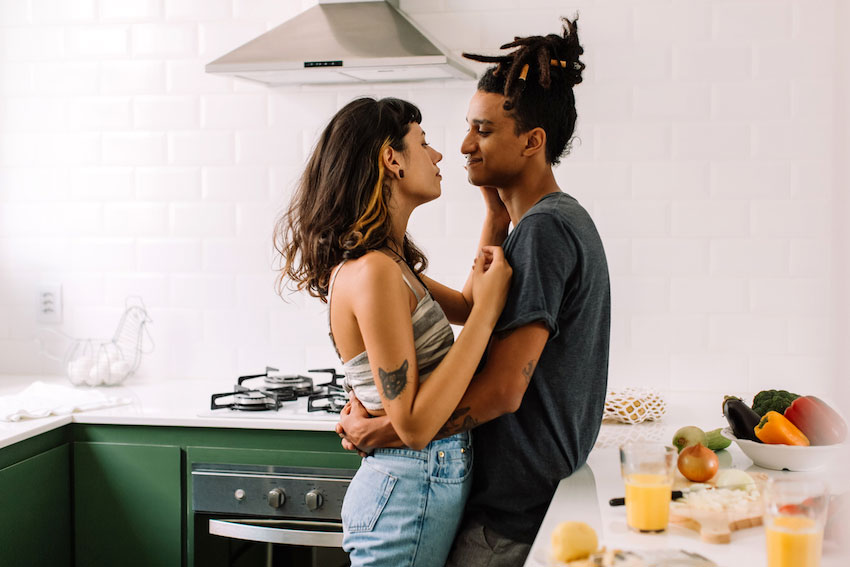 Couple being intimate in the kitchen