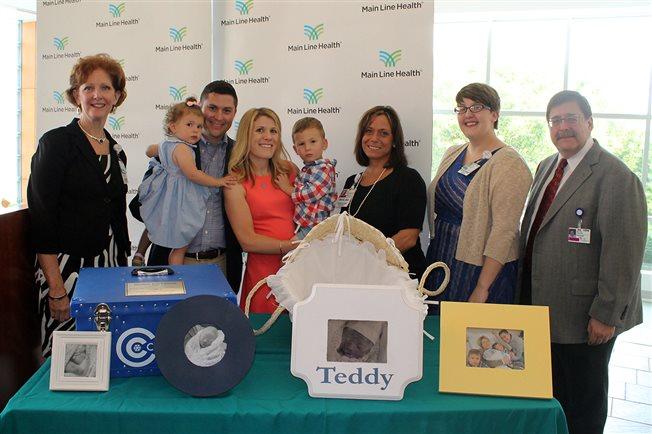 (Left to right) Margie Iacobacci, vice president of patient services at Lankenau Medical Center; the Clement family (their daughter Grace, who is 2, Chris and Beth Clement, and their son Henry, who is 3); Lynne Menei, nurse manager of the Lankenau Labor and Delivery Unit; Casey Bien-Aime, Lankenau Medical Center chaplain; and Dr. Norman Brest, Lankenau Medical Center campus chief of the department of OB/GYN