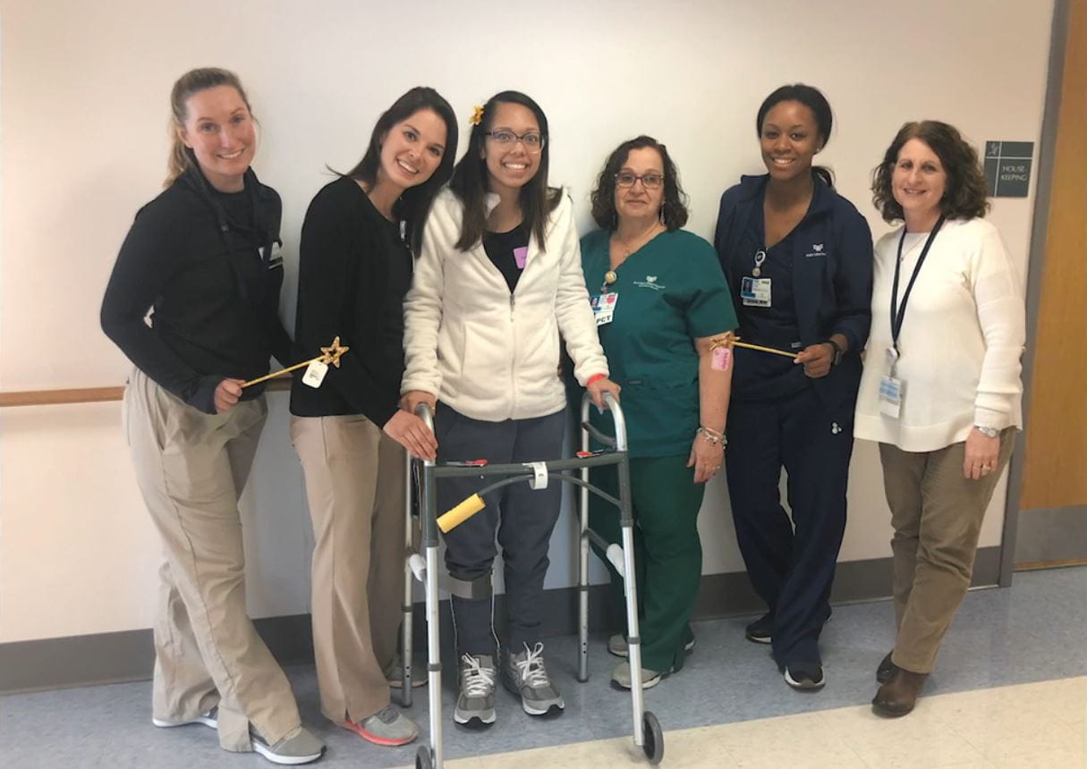 Alexandria Warner with therapy team