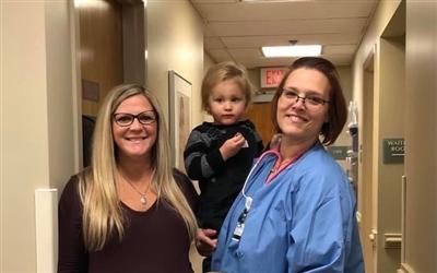 Kathleen during an office visit with her two sons and Denise