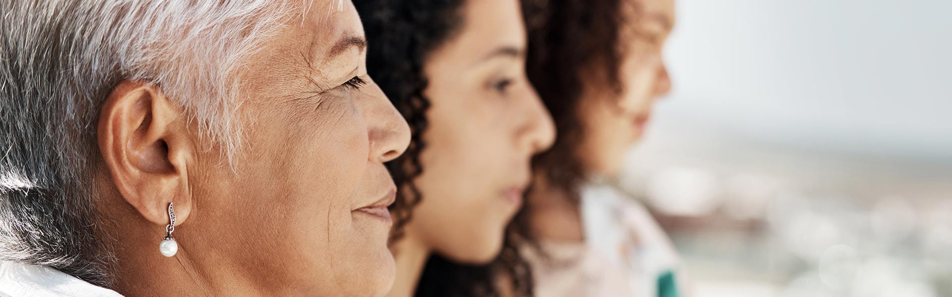 three woman staring to the right