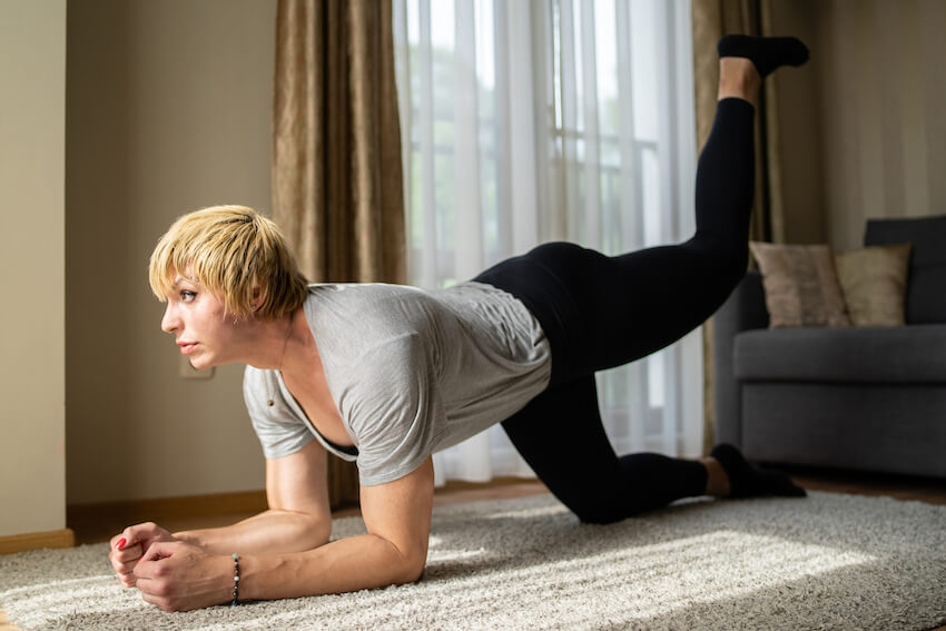 transgender person doing floor exercises