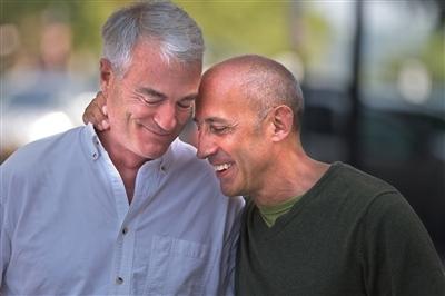 Smiling older male couple