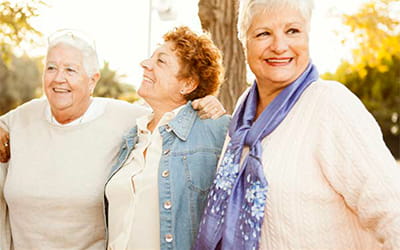Three older woman smiling and enjoy outside Three older woman smiling and enjoy outside