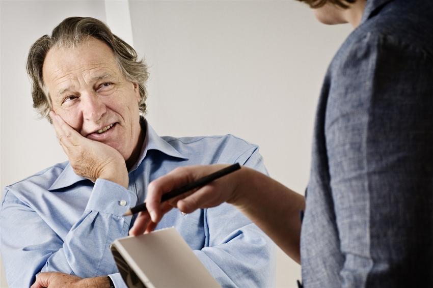 Older gentleman talking with a counselor Older gentleman talking with a counselor