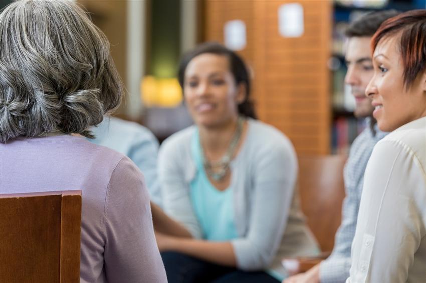 Unrecognizable woman shares story in group therapy Unrecognizable woman shares story in group therapy