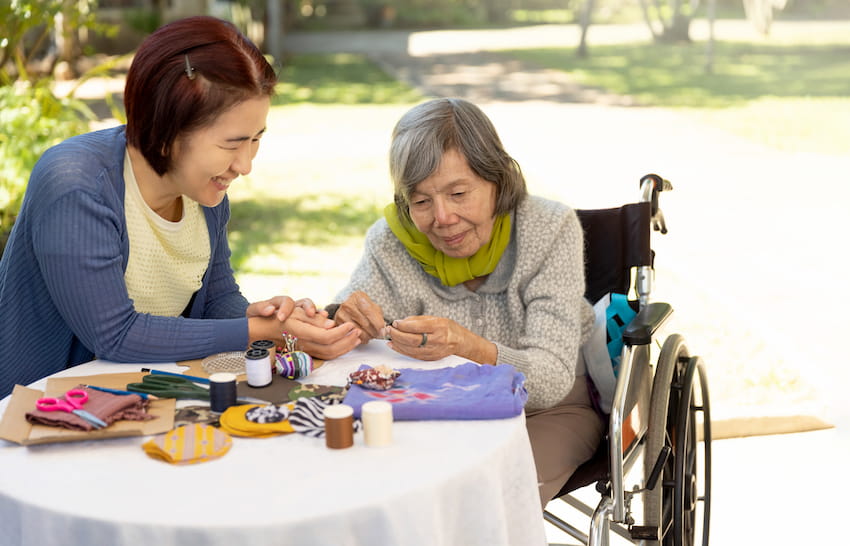 Therapist assisting patient using art therapy