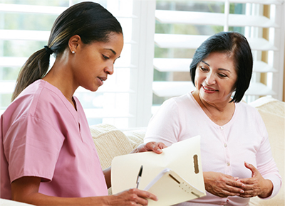 Woman sitting with a health care provider talking