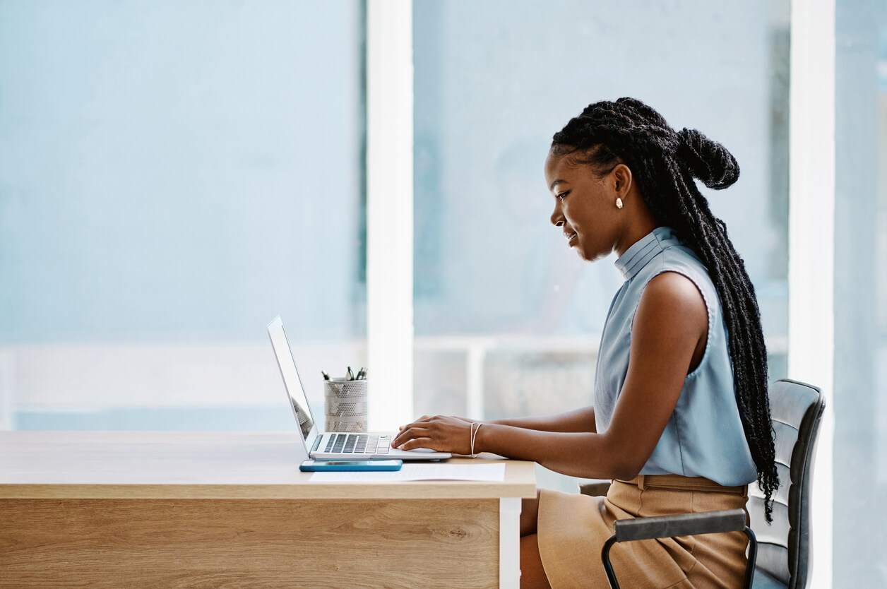 Young black businesswoman working on a laptop