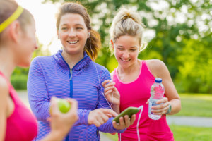 happy young women outside getting ready to exercise